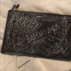 Balenciaga Graffiti Clutch Designer Black Clutch For Daily Use, Designer Black Leather Pouch, Designer Shopping Clutch Pouch, Designer Clutch Pouch For Shopping, Designer Pouch Clutch For Shopping, Designer Black Pouch For Everyday, Designer Black Pouch For Daily Use, Designer Clutch Pouch For Everyday, Designer Everyday Clutch Pouch