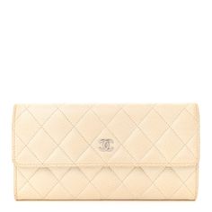 This is an authentic CHANEL Caviar Quilted Large Flap Wallet in Ivory. This chic wallet is crafted of diamond quilted luxurious caviar leather in off white. It featuresa front flap with a small polished silver Chanel CC logo. Thisopens with a snap to a matching leather and fabricinterior with a card slot panel, patch pockets and a coin compartment. Elegant Quilted Wallet For Formal Occasions, Classic Cream Bifold Wallet, Elegant Quilted Wallets For Formal Occasions, Classic Bifold Cream Wallet, Classic Cream Wallet, Elegant Quilted Rectangular Wallet, Luxury Beige Bifold Wallet, Classic Cream Wallet For Formal Occasions, Elegant Beige Evening Wallets