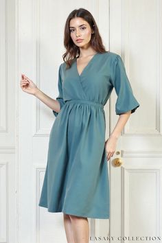 Elegant Teal Wrap Midi Dress with Elastic Waist and Flutter Sleeves Teal Midi Dress, Teal Dresses, Dress With Elastic Waist, Dress Night Out, Blouse Tank Top, Sweater Trends, Teal Dress, Loungewear Jumpsuit, Wrap Midi Dress