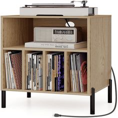 an old record player is sitting on top of a shelf