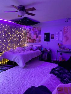 a bedroom with purple lights on the walls