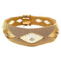 Stylishly sleek with a contoured shape, the patterned tightly woven fourteen karat 14K yellow gold mesh is accented with five unique marquise shaped stations each illuminated with twin diamonds. This stunning bracelet is 7-1/4 inches in length and is 3/4 inch at its widest center point. Flexible, it elegantly wraps the wrist and is finished with a a box clasp and double safety clips. Stamped 14K . Gift boxed. Thigh Jewelry, Latina Jewelry, Retro Bracelet, Center Point, Bold Necklace, Dope Jewelry, Box Clasp, Statement Bracelet, Statement Jewelry