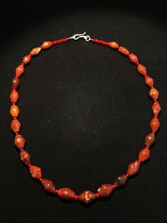 antique carnelian strand strand A LARGE STRAND OF ANCIENT CARNELIAN AGATE BEADS Traditional Red Rondelle Necklaces, Artisan Red Beads With Natural Stones, Single Strand Carnelian Beads, Red Artisan Beads With Natural Stones, Red Carnelian Single Strand Necklace, Oval Carnelian Gemstone Beads, Oval Carnelian Beads, Polished Oval Carnelian Beads, Artisan Red Carnelian Beaded Necklaces