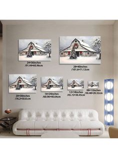 a living room with white furniture and pictures on the wall above it's couch