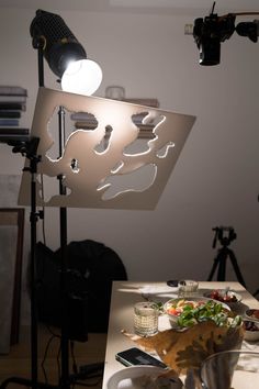 a table with food on it in front of a camera set up for a photo shoot