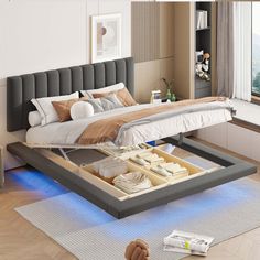 a bed that is sitting in the middle of a room with an open drawer underneath it