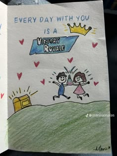 an open book with a drawing of two children running towards a mailbox that says every day with you is a victory royale