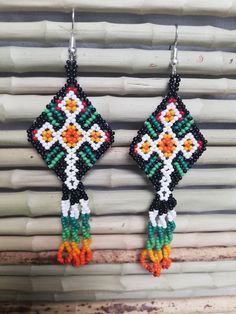 All of our earrings are made with sterling silver hooks, they are made of 925 sterling silver and the clasps of the earrings are made of transparent silicone. Especially for people with mild sensitivity. Beaded earrings, mexican earrings, huichol art, gift for her. Beaded jewelry made of beads is an important element of the Huichol clothing, the use both women and men, especially certain necklaces, earrings and bracelets. Huichol art and handicrafts are recognized worldwide and are setting trend Southwestern Handmade Earrings For Beach, Handmade Southwestern Multicolor Earrings, Handmade Southwestern Green Beaded Earrings, Handmade Southwestern Green Earrings, Southwestern Handwoven Beaded Earrings For Gift, Southwestern Handwoven Earrings Gift, Traditional Green Handwoven Beaded Earrings, Huichol Clothing, Earring Inspired