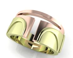 a gold ring with the letter t on it's center and two tone bands