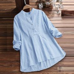 Pattern: PlaidFabric name: cotton blendProduct Category: ShirtSleeve type: regular sleeveCollar type: Stand CollarSleeve length: long sleeve  USUK/AUSEURBustLengthSleeve LengthCMinchCMinchCMinchS4-6103610039.37 6726.38 5822.83 M8-10123810541.34 6826.77 5923.23 L12-14144011043.31 6927.17 6023.62 XL16-18164211545.28 7027.56 6124.02 XXL20-22184412047.24 7127.95 6224.41 3XL24-26204612549.21 7228.35 6324.80 4XL28-30224813051.18 7328.74 6425.20 5XL32-34245013553.15 7429.13 6525.59 Blue Tops With Roll-up Sleeves For Spring, Fall Blue Blouse With Roll-up Sleeves, Long Sleeve Shirt With Roll-up Sleeves For Fall, Cotton Blouse With Roll-up Sleeves For Fall, Blue Relaxed Fit Shirt For Fall, Light Blue Relaxed Fit Cotton Shirt, Relaxed Fit Long Sleeve Shirt With Roll-up Sleeves, Light Blue Cotton Blouse With Pockets, Relaxed Fit Cotton Tops With Roll-up Sleeves