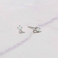 These opal studs are super cute and dainty! They are small, so are perfect for a minimalist look, for 2nd + piercings, or even for kids! Made of 925 Sterling Silver Sold as a Pair Measures 5 mm Push Back Closure Hypoallergenic and nickel free Made of lab created opal, and highest grade cz stone Minimalist Hypoallergenic Opal Earrings, Minimalist Opal Earrings, Minimalist White Opal Earrings, Minimalist Hypoallergenic White Piercings, Dainty White Piercings As Gift, Tiny White Minimalist Piercings, Dainty Tiny White Cartilage Earrings, White Dainty Nickel-free Cartilage Earrings, Dainty White Nickel-free Cartilage Earrings