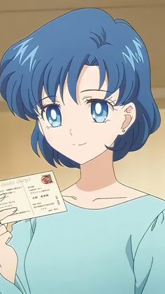 a woman with blue hair holding up a piece of paper