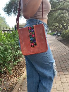 This beautiful handbag with adjustable handle is handmade by Mexican Artisans. Pair the bag with your favorite dress or jeans - it will instantly liven up any outfit! Rectangular Embroidered Satchel For Everyday Use, Hand-stitched Crossbody Bags For Everyday Use, Embroidered Leather Bags For Festivals, Festival Embroidered Leather Bags, Casual Embroidered Crossbody Shoulder Bag, Hand-stitched Crossbody Shoulder Bag For Daily Use, Multicolor Embroidery Crossbody Shoulder Bag, Festival Leather Embroidered Bags, Traditional Handmade Bag For Spring