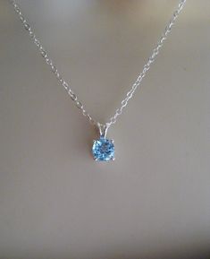 Similar items: ALLDANAE.etsy.com Please read my shop policies before ordering: https://www.etsy.com/shop/AllDanae#policies A beautiful blue topaz gem strung on a sparkling sterling silver chain. The sky blue color of the topaz is exquisite. It measures just 6mm (about 1/4 inch) in diameter, and has excellent clarity and sparkle. The necklace length is customizable. Choose your perfect size from the drop down menu. ♥ Please note: my jewelry is not intended for infants or young children. Necklaces Light Blue Topaz Jewelry Gift, Light Blue Topaz Jewelry For Gift, Elegant Light Blue Crystal Necklace For Gift, Elegant Light Blue Crystal Necklace Gift, Blue Topaz Necklaces For Wedding, Blue Topaz Birthstone Necklace As Gift, Blue Topaz Necklace For Gift, Blue Topaz Round Pendant Jewelry, Blue Topaz Round Pendant Necklace