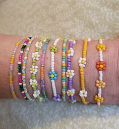 This listing is a collection of 10, spring-themed, dainty minimalistic beaded bracelets! Perfect for Easter and the whole spring season. Boho stackable bracelets strung on strong beading string, very durable making them perfect for everyday wear. A wonderful gift for someone or yourself! Each bracelet is sold separately and numbered in pictures 2 and 3 so you can make sure you're getting the right bracelet. They come in many sizes, and let me know if you don't see yours! All of our jewelry comes gift-wrapped in a little bag, making them the perfect gifts for best friends, gifts for her or to treat yourself! Or would be cute friendship bracelets! They ship very quickly! Spice up your jewelry collection with these beaded bracelets. If you have any questions or anything else feel free to cont Trendy Colorful Beaded Friendship Bracelets For Spring, Trendy Beaded Bracelets For Friendship In Spring, Trendy Spring Friendship Bracelets With Colorful Beads, Bohemian Friendship Bracelets With Colorful Beads For Spring, Bohemian Beaded Bracelets For Friendship In Spring, Bohemian Beaded Bracelets For Friendship And Spring, Spring Bohemian Beaded Friendship Bracelets, Cute White Friendship Bracelets For Spring, Trendy Spring Beaded Letter Bracelets