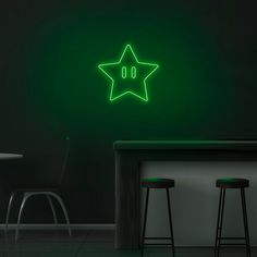 a green neon sign that is on the side of a wall next to two stools