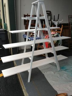 a white ladder leaning up against a wall