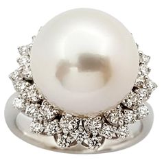 South Sea Pearl with Diamond 0.38 carat Ring set in 18 Karat White Gold Settings Width: 1.8 cm Length: 1.8 cm Ring Size: 51 Total Weight: 8.92 grams South Sea Pearl: 12.6 mm "We first opened doors in 1980 when it was then situated in the vicinity of the Victory Monument; a small and modest storefront with a couple of counters. From its humble beginnings to where it stands today, our company has proven its abilities as a jeweler. Since the beginning, we have been supplying fine quality pieces to Timeless White Gold Pearl Ring With Diamonds, Luxury Pearl Ring With Diamond Pave Setting, Luxury Diamond White Brilliant Cut Pearl Ring, Luxury Brilliant Cut Pearl Ring For Formal Occasions, Luxury Pearl Ring With Brilliant Cut For Formal Occasions, Timeless Formal Pearl Ring In Diamond White, Timeless Diamond White Brilliant Cut Pearl Ring, Luxury Brilliant Cut Diamond Pearl Ring, Classic Brilliant Cut Diamond White Pearl Ring