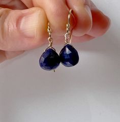 Our dainty genuine sapphire drop earrings are the perfect lightweight, simple, everyday dangling earring. The sparkling genuine sapphire gemstones make a minimalist statement. They make a great birthstone earring gift as we offer a choice of every month's birthstone as well as other popular gemstones in the drop-down menu. Sapphire is the September birthstone. We also offer these earrings in gold filled, sterling silver, rose gold, and 14k gold. The model is wearing the sapphire November birthstone earrings in 14k gold filled. CRAFTSMANSHIP  Jewelry is handmade by us in our NYC studio. We focus on craftsmanship and quality using only the highest quality materials and handpicked genuine gemstones.  PACKAGING We take pride in creating beautifully packaged orders. Jewelry arrives delicately w Teardrop Sapphire Earrings For Gift, Sapphire Teardrop Gemstone Earrings, Classic Teardrop Sapphire Earrings, Minimalist Faceted Everyday Earrings, Minimalist Everyday Faceted Earrings, Sapphire Teardrop Birthstone Earrings, Sapphire Hypoallergenic Drop Earrings, Hypoallergenic Sapphire Drop Earrings, Teardrop Sapphire Jewelry With Matching Earrings