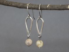 "Agate Earrings, Teardrop Earrings, Faceted Agate Earrings, Agate Dangle, neutral earring, everyday earring A chunky agate bead is secured by a sterling silver \"bar bell\" style pin that also binds a hand wrought teardrop to this lovely gemstone. These beige earrings are perfect for that gift you have to buy! They come delivered in a box ready for gift giving. Metal: Sterling Silver Size: about 2\" from top of ear wire to bottom and about 3/8\" at the widest point. Finish: oxidized (blackened) Elegant Agate Earrings, Elegant Everyday Agate Jewelry, Handmade Teardrop Agate Earrings, Elegant Teardrop Agate Earrings, Agate Dangle Earrings With Ear Wire, Neutral Earrings, Beige Earrings, Earrings Teardrop, Blue Topaz Earrings