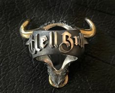 🔱 Embrace the strength, power, and spiritual guidance of the Hell Bull ring. Rise up to any challenge with this extraordinary piece of jewelry loaded with unapologetic Mortis Ores DNA and created with meticulous craftmanship. Designed to honor the fight through any obstacles, this Hell Bull ring will give you the bullish spirit to rise and win it head on. Make it a symbol of your strength and wear it as a statement! 🔱 The ring weighs at approximately 75 grams of 925 sterling silver with 22K go Hand Forged Symbolic Rings For Collectors, Symbolic Hand Forged Rings For Collectors, Symbolic Black Jewelry For Ceremonial Occasions, Symbolic Black Jewelry For Ceremonial Use, Symbolic Black Jewelry For Ceremonies, Ceremonial Symbolic Black Rings, Collectible Symbolic Black Skull Ring, Custom Black Jewelry With Hardware For Gift, Black Jewelry With Custom Hardware As Gift