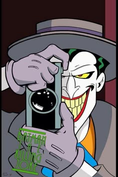 the joker taking a selfie with his camera