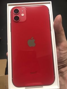 the red iphone 11 is in its box