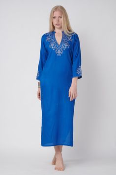 this ocean blue gallabia dress embroided in silver cord is the summer beach look with small sleeves and open 27 cm v neck sexy and suitable for summer 125 cm length embroidery over the v neck, sleeves and back - great look! V-neck Kaftan With Embroidered Neckline For Festive, Festive V-neck Kaftan With Embroidered Neckline, Festive V-neck Kaftan, Blue V-neck Dress With Resham Embroidery, Festive Blue V-neck Kaftan, Blue Traditional Kurta With Embroidered Neckline, Traditional Blue Kurta With Embroidered Neckline, Elegant Kaftan With Chikankari Embroidery And V-neck, Elegant V-neck Kaftan With Chikankari Embroidery