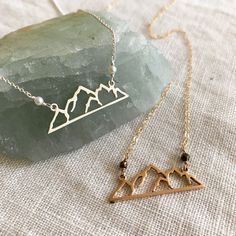 Here in Oregon we have a mountain range called the 3 Sisters and it is located in the 3 Sisters Wilderness in Central Oregon. Of course this pendant could represent any mountain range and would be a perfect gift to anyone who loves to be in the mountains connecting to nature. Offered on 18" chain. (If you would like on 16" chain, just write a note during check out) Sterling Silver with Freshwater Pearl Accents on 18" Chain Bronze with Labradorite accents on 18" 14K Gold Filled Chain Pendants mad 3 Sisters Mountain, Mountain Outline, Connecting To Nature, Mountain Necklace, 3 Sisters, Central Oregon, Tree Necklace, Mountain Range, Recycled Sterling Silver