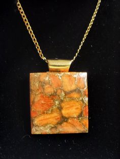 "20\" Apple Coral Cabochon Necklace on Golf Filled Bail and Chain  Pendant is 15/8\" long including the bail Comes in a nice leatherette gift box" Gold Rectangular Necklace For Keepsakes, Gold Rectangular Keepsake Necklace, Brown Rectangular Metal Jewelry, Rectangular Brown Metal Jewelry, Bronze Cabochon Necklace For Gifts, Brown Necklaces With Lobster Clasp As Gift, Brown Necklace With Lobster Clasp For Gift, Brown Necklace With Lobster Clasp As Gift, Nickel-free Brown Necklace For Gift