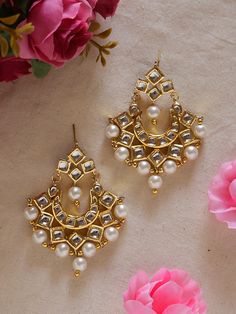 Add a touch of timeless elegance to your jewelry collection with these beautifully crafted golden kundan earrings lined with small jhumkas.  Designed with intricate details and high-quality materials, these earrings are the perfect accessory to elevate any outfit, whether it's for a special occasion or adding some glamour to your everyday look. The stunning golden color of these earrings makes them versatile and easy to pair with any outfit. The intricate design of the kundan setting adds a touc Small Golden Earrings, Small Kundan Earrings, Gold Kundan Danglers For Gift, Gold Kundan Danglers, Kundan Yellow Gold Chandbalis As A Gift, Yellow Gold Kundan Chandbalis As A Gift, Kundan Chandbalis In Yellow Gold For Gifts, Kundan Chandbalis In Yellow Gold As A Gift, Gold Kundan Necklace With Matching Earrings