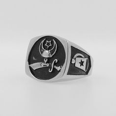 Show your pride and support for a great cause with our Shriners Ring in sleek black and silver titanium steel. This durable and stylish ring features the iconic Shriners emblem, making it the perfect way to honor this noble organization. Every purchase helps make a difference.We ship worldwide to 185 countries! Please allow 1-2 business weeks for your order to arrive. Black Stainless Steel Promise Ring, Black Stainless Steel Engraved Ring As Gift, Black Stainless Steel Engraved Ring For Gift, Symbolic Black Stainless Steel Rings, Silver Stainless Steel Ring With Brushed Finish, Black Stainless Steel Signet Promise Ring, Adjustable Black Symbolic Signet Ring, Adjustable Silver Titanium Rings, Adjustable Stainless Steel Engraved Ring