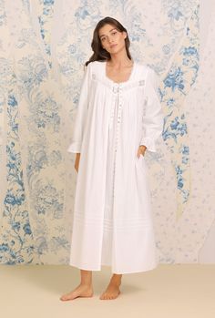 A clean and classic look, this 100% cotton nightgown is designed with a delicate dobby stripe, accented by venise lace at the neckline, pintucks at the neckline and skirt, and a placket of akoya shell buttons. Style Number: E5220079-100 Length: 49 ½" 100% Cotton Dobby Stripe WovenExclusive of ornamentation Model is wearing size S. She is 5'8", Bust 32", Waist 24", Hips 34" Imported Balcony Decking, Ballet Gown, Edwardian Nightgown, Clothes Sleep, Linen Gown, Victorian Nightgown, Elegant Wardrobe, Sleep Gown, Aesthetic Galaxy