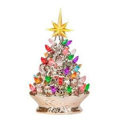 The RJ Legend 9.6-Inch Champagne Gold Ceramic Christmas decorative tree is a timeless holiday decoration which you simply must have! Made from only the finest ceramics, hand painted and handcrafted with extra-attention to the finest of details, this pre-lit tree will transform your home, preserving that cozy atmosphere needed for a proper white snow period. Each and every ceramic Christmas Tree has 35 or more multiple color beads. Although small, this Christmas tree will shine bright, lighting u Centerpiece For Christmas, Silver Christmas Tree Decorations, Winter Tree Decorations, Gold Christmas Tree Decorations, Retro Christmas Tree, Ceramic Tree, Christmas Tabletop Decor, Silver Christmas Tree, Tabletop Christmas Tree