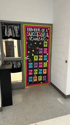 a classroom door decorated with letters and numbers