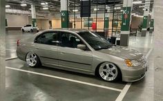 a silver car parked in a parking garage