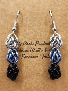 the earrings are made with black and blue beads