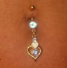 an image of a belly button with a heart charm on it and the words $ 32 19