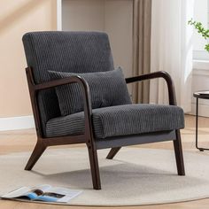 a chair sitting on top of a rug in a living room