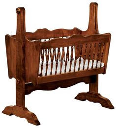 a wooden baby crib with white sheets on the top and bottom rails, in front of a white background