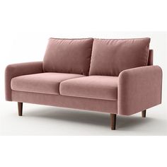 a pink couch sitting on top of a white floor