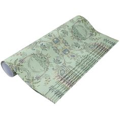 a set of four placemats with green and blue floral designs on the front