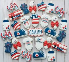 decorated cookies arranged in the shape of american flags and shoes with name written on them