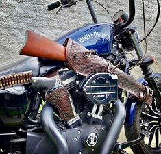 a close up of a motorcycle with leather straps on it's handlebars