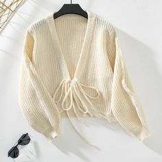 Fabric name: polyesterMain fabric composition: polyester (polyester fiber)Pattern: solid colorVersion: loose typeLength: short (40cm <; Length ≤50cm)Collar type: V-neckSleeve length: long sleevesColor: apricot, blueSize: S,M,L,XL Casual Knitted Sweater, Loose Knit Cardigan, Áo Len Cardigan, Cardigan For Women, Casual Tie, Beige Cardigan, Knitted Tops, Spring Outfits Women, Fall Sweaters