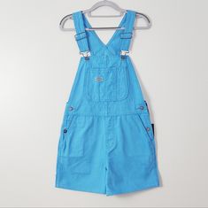 Product Details Msrp: $84.99 Dickies Relaxed Fit Duck Bib Shortalls. The Dickies Duck Canvas Overall Shorts Are Crafted With Authentic Fabrication And Detailing. The Shortalls Sit Above The Knee And Feature A Large Bib Pocket On The Front, Two Back Pockets With Tool Insert, Hammer Loop Detail, And Brass Rivet Button Closure. They're Made To Last With Our Durable Brushed Duck Canvas Fabric. 100% Cotton. Size Xs Inseam: 4'' Waist: 15" Across Length: 33.5" Condition: New With Tags. B7 Dickie Jeans, Blue Overalls, Jean Overalls, Duck Canvas, Rayon Pants, Jelly Shoes, Pajama Shirt, Above The Knee, Overall Shorts