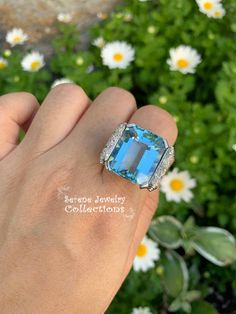 Thank you for coming in! Impressive blue aquamarine Platinum vintage diamond ring with a fancy diamond setting. Ring Size: 6 Total Weight: 14.03 grams Precious Metal: Platinum Precious stones: -Aquamarine Center Stone: 18.5 carats, 18.7mmx15.5mm -White Round Diamonds: 0.6 carats, QTY: 20 Luxury Blue Topaz Ring With Diamond Accents, Luxury Aquamarine Diamond Ring With Prong Setting, Aquamarine Brilliant Cut Diamond Ring For Formal Occasions, Formal Aquamarine Diamond Ring With Brilliant Cut, Formal Aquamarine Ring With Diamond Accents, Luxury Light Blue Ring With Brilliant Cut, Formal Blue Topaz Diamond Ring With Gemstone Accents, Luxury Light Blue Brilliant Cut Ring, Formal Light Blue Diamond Ring