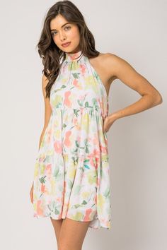 Floral print halter dress Sundress With Tropical Print For Day Out, Chic Tropical Print Midi Dress For Summer, Printed Mini Dress For Summer Day Out, Summer Tropical Print Dress For Garden Party, Summer Garden Party Dress With Tropical Print, Chic Midi Dress With Elastic Halter Neck, Chic Halter Neck Midi Dress With Elastic Neckline, Chic Printed Mini Floral Dress, Chic Mini Floral Printed Dress