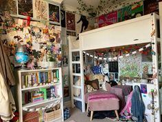 a room filled with lots of clutter and bookshelves covered in magnets