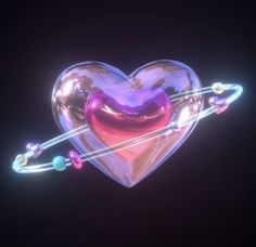 a glass heart with two strings attached to it and an arrow in the middle, on a black background